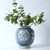 Approx. 10" Tall Blue and White Vase with Flower Motif