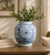 Approx. 10" Tall Blue and White Vase with Flower Motif