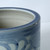 Approx. 8" Tall Blue and White Planter with Flower Motif