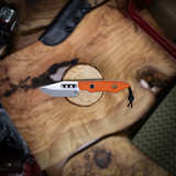 Heretic Knives Kobold Bowie Stonewash standard ORANGE G10 handle scales.