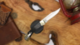 BUCK 110 SLIM ELITE MAGNACUT EBONY-BRASS HANDLE CLIP POINT BLADE 14259