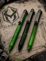 HERETIC KNIVES SCRIBE FLIPPER PEN BLACK AND GREEN FADE WITH GREEN SPLATTER MAVERICK CUSTOMS COLLAB