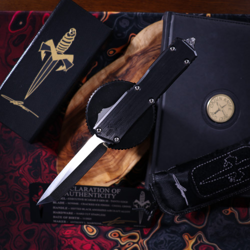 Microtech Executive Scarab II Gen III – Tanto Edge Cracked Ice Finish Chisel Grind Hefted Black Anodized Alloy Hard Cut Stainless 1177-CICGHFHCSS-MCK