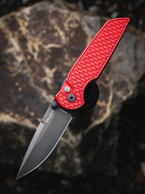 PROTECH TR-3 INTEGRITY THUMBSTUD MANUAL, RELIC RED HANDLE, DLC  MAGNACUT BLADE,DOUBLE THUMBSTUDS, BLACK LIP PEARL BUTTON, BLACK HARDWARE, WIDE DEEP CARRY POCKET CLIP