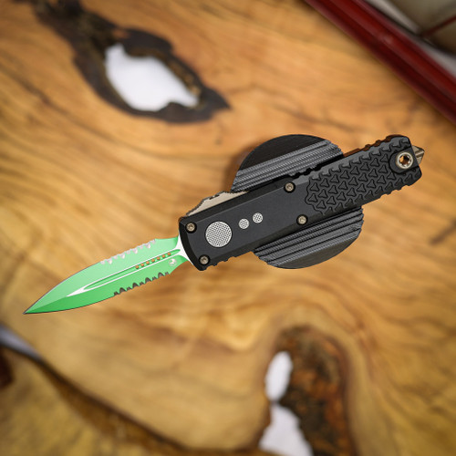 MICROTECH UTX-85 GEN IV D/E PART SERRATE JEDI MASTER W/GREEN BLADE, BRONZE HARDWARE, & BLACK CHASSIS