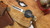 BUCK 110 SLIM ELITE MAGNACUT EBONY-BRASS HANDLE CLIP POINT BLADE 14259