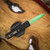 MICROTECH UTX-85 GEN IV D/E PART SERRATE JEDI MASTER W/GREEN BLADE, BRONZE HARDWARE, & BLACK CHASSIS