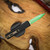 MICROTECH UTX-85 GEN IV D/E PART SERRATE JEDI MASTER W/GREEN BLADE, BRONZE HARDWARE, & BLACK CHASSIS 12324-2JM