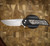 PROTECH KNIVES MORDAX, BLACK HANDLE, CASTED WHITE BRASS "USA 250TH" DESIGN, STONEWASH MAGNACUT BLADE, WHITE PEARL BUTTON, SERIALIZED OF 100