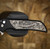 PROTECH KNIVES MORDAX, BLACK HANDLE, CASTED WHITE BRASS "USA 250TH" DESIGN, STONEWASH MAGNACUT BLADE, WHITE PEARL BUTTON, SERIALIZED OF 100