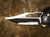 HERETIC KNIVES WRAITH MANUAL BOWIE CRACKED ICE CARBON FIBER CHASSIS ABALONE BUTTON INLAY FLAMED TITANIUM HARDWARE BSATL26-004