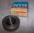 NEW NTN BALL BEARING CARTRIDGE CAST IRON SET SCREW UCC205-100D1