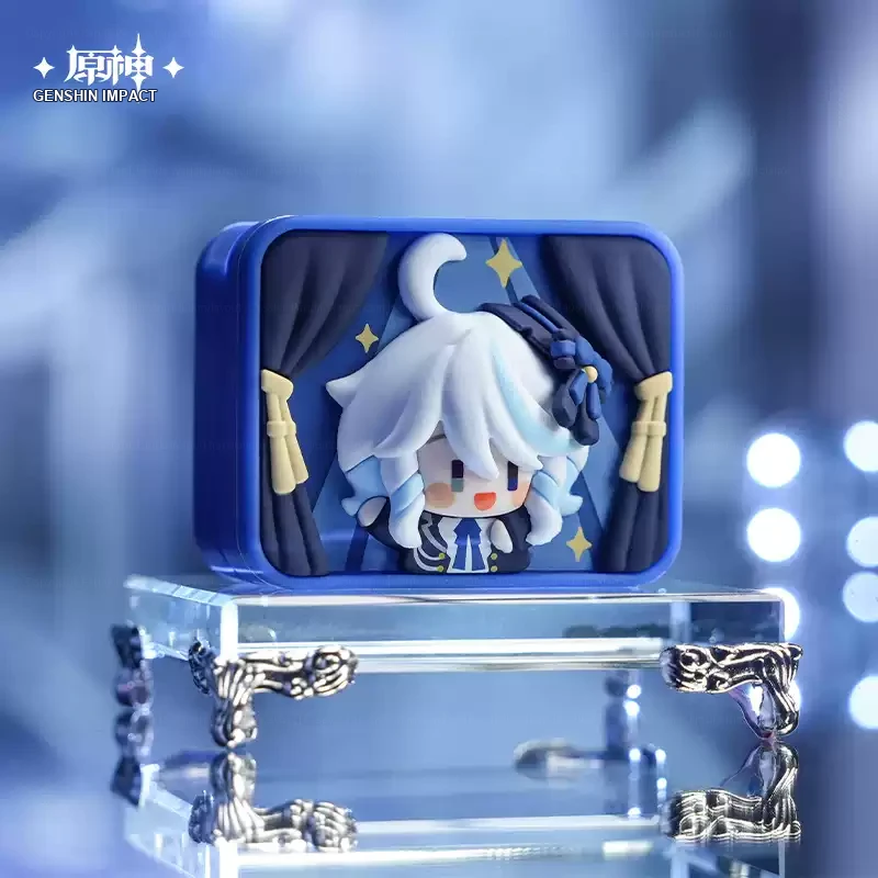 Furina chibi display piece in a blue stage-curtain case.
