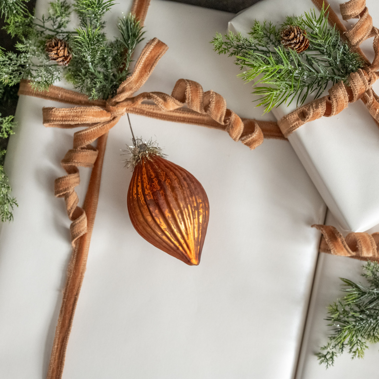 ORANGE GLASS ORNAMENT W/ TINSEL TOP