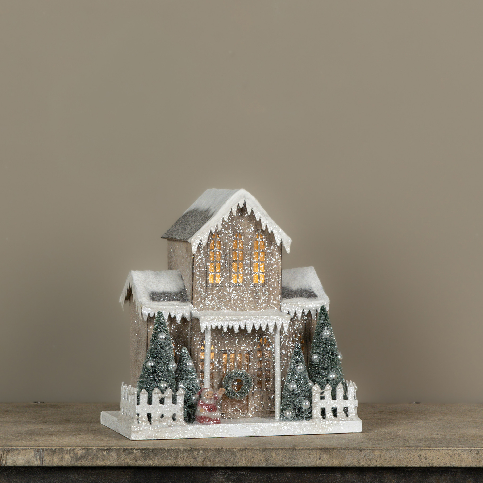 Lighted Snow-Covered House with Porch