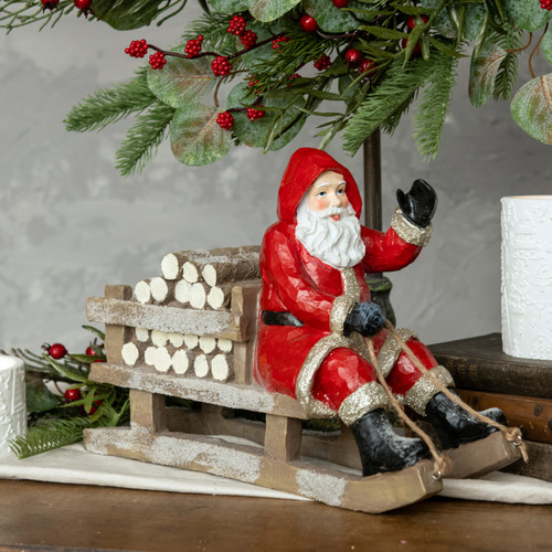 RED SLEDDING SANTA