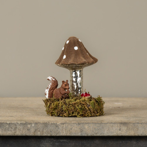 BROWN FLOCKED MUSHROOM ON MOSSY BASE