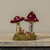 BURGUNDY FLOCKED MUSHROOMS ON MOSSY BASE