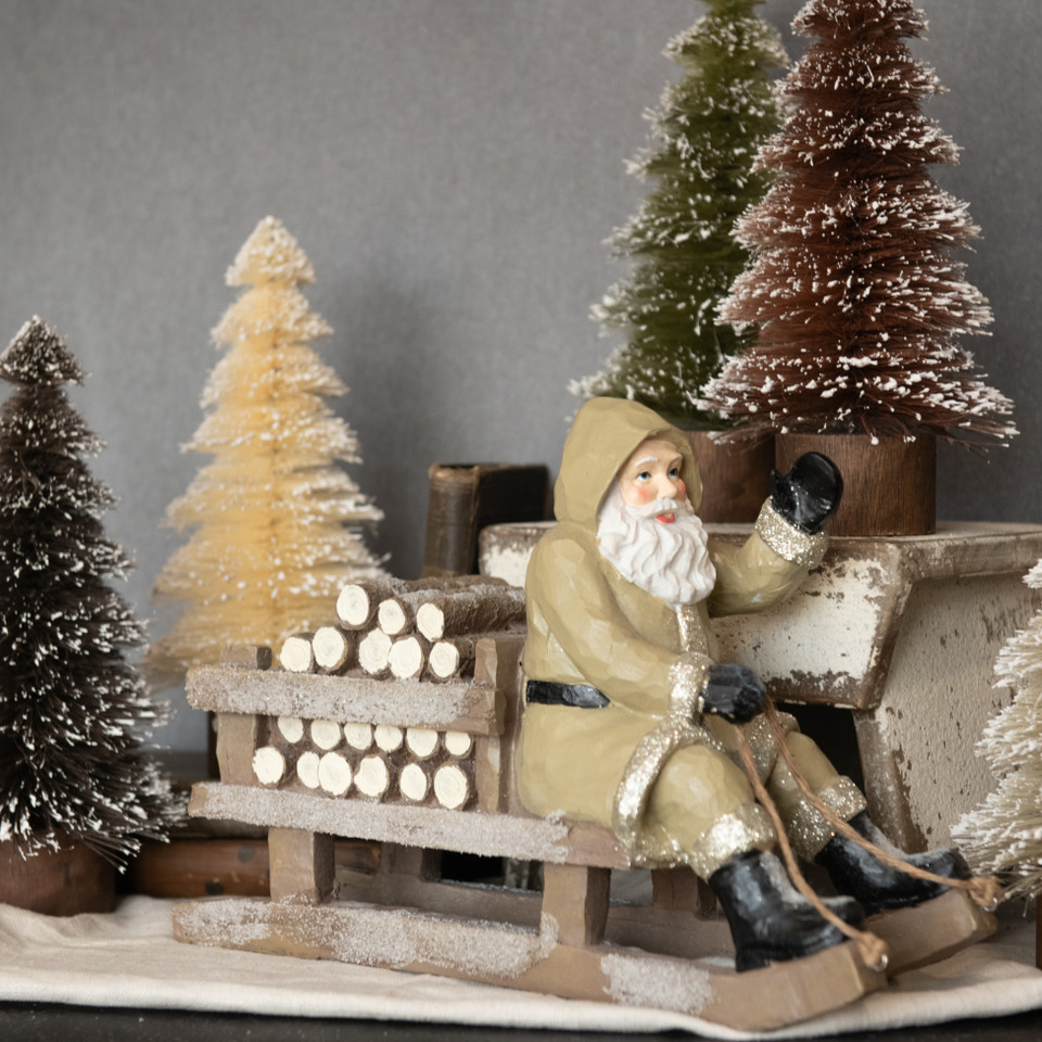 TAN SLEDDING SANTA