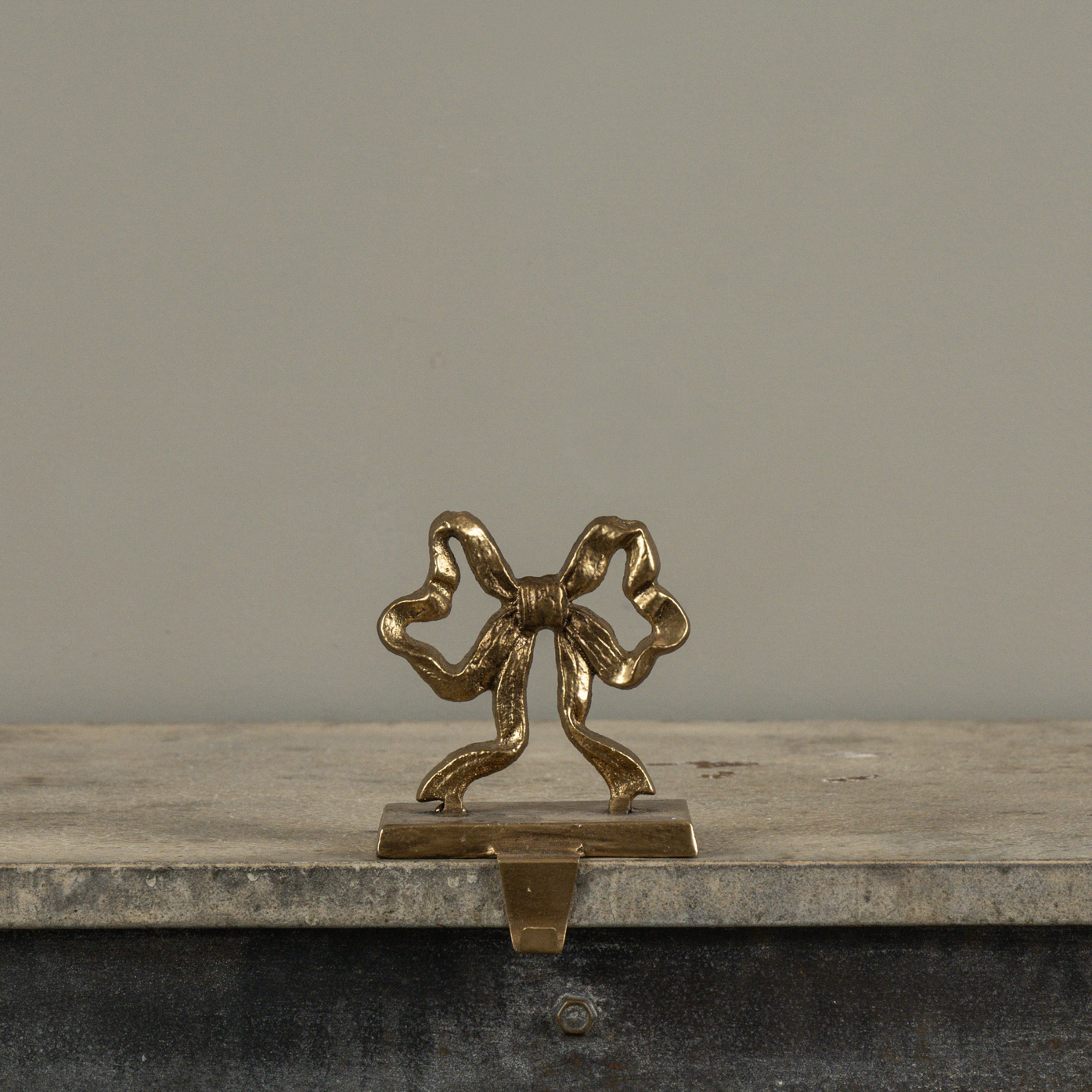 GOLD BOW STOCKING HOLDER