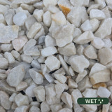 Close up photograph of Spanish White. When wet, stones retain brightness and take on a glistening, reflective glow.