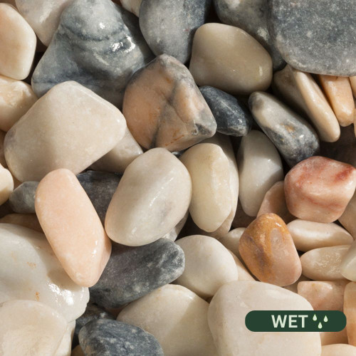 Close up photograph of Flamingo Pebbles. When wet colors deepen to richer pinks and warm creams with a shiny, enhanced finish.