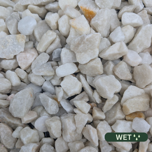 Close up photograph of Spanish White. When wet, stones retain brightness and take on a glistening, reflective glow.