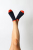Navy and orange Navy and Orange Pretty Polly Stripe Bamboo Trainer Socks being modeled