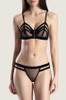 Model wearing the Aubade Boite a Desir Velvet Bra and Thong Set