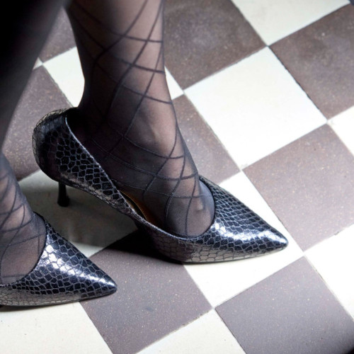 Lifestyle image of the Pretty Polly Ribbon Pattern Tights