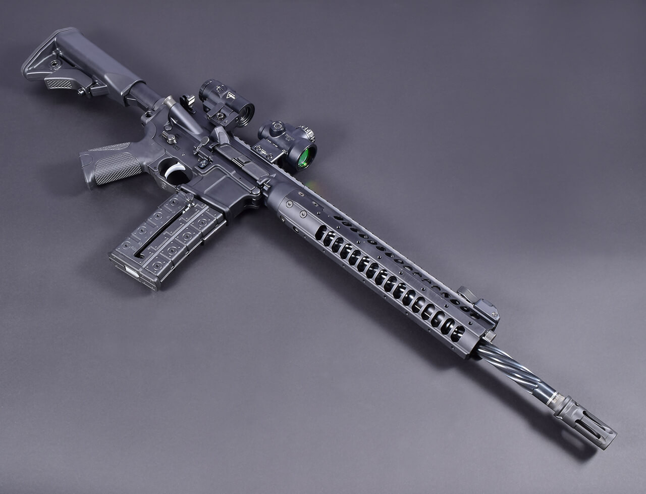 LWRC IC-SPR with Trijicon MRO HD Magnifier Combo & SureFire WARCOMP in 5.56x45 NATO Angled View