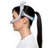 ResMed  AirTouch N30i cloth nasal cradle mask for comfortable Canadian sleep therapy-Side view fitted on woman
