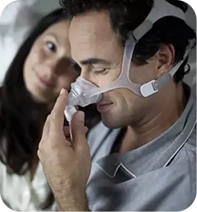 Man on video call wearing CPAP mask