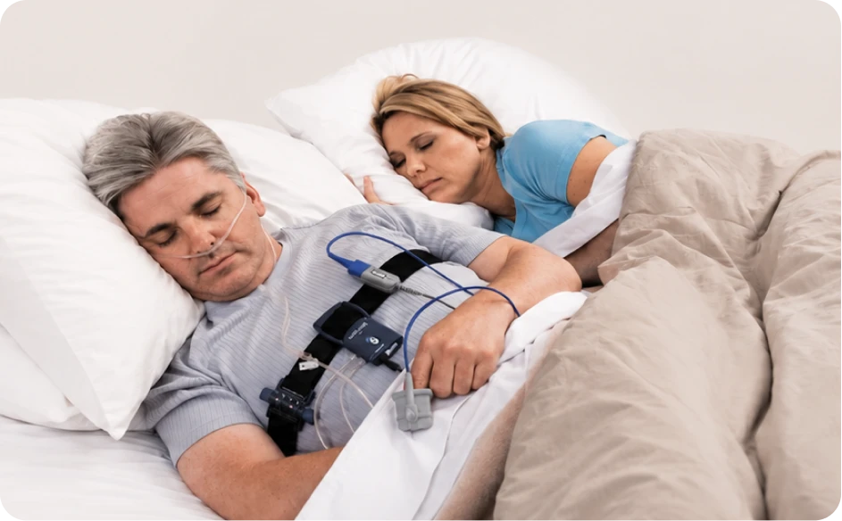 Couple sleeping comfortably in bed