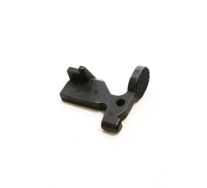 Top-down angled view of DSI black steel bolt catch for AR-15 rifles, precision machined for reliable bolt hold-open and release