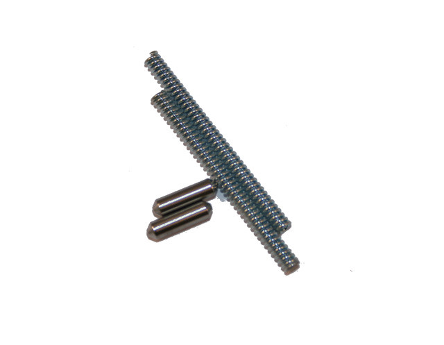 Top-down view of DSI takedown detent and spring kit for AR-15 rifles including two yellow zinc coated detent pins and two springs