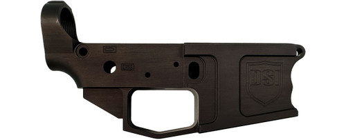 Front side view of DS-15 billet stripped lower receiver with integrated closed trigger guard and finger-grooved mag well in Black Anodize finish