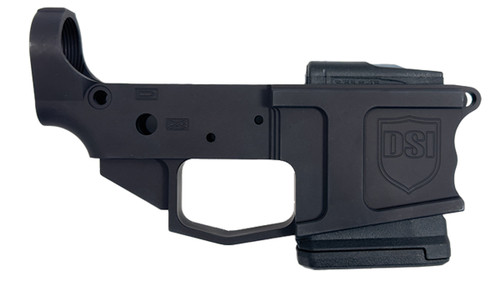 Front side view of DS-15 stripped billet lower receiver in black finish with integrated closed winter trigger guard, finger-grooved magwell, and factory-installed Magpul PMAG Gen M3 10-round fixed magazine