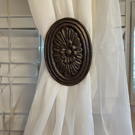 Oval floral drapery medallion – 5-1/2″ H x 3-1/4″ W with a 3″ – 5″ projection.