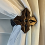 Extra small contemporary drapery medallion 1-3/4″ square with a 3″ – 5″ projection.