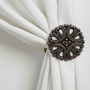 Traditional floral medium drapery medallion and hardware from Metropolis Iron (metroiron)