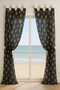 Beach themed window treatment using scallop seashell drapery medallions
