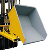 A yellow tipping skip attached to a forklift that is tilting forwards
