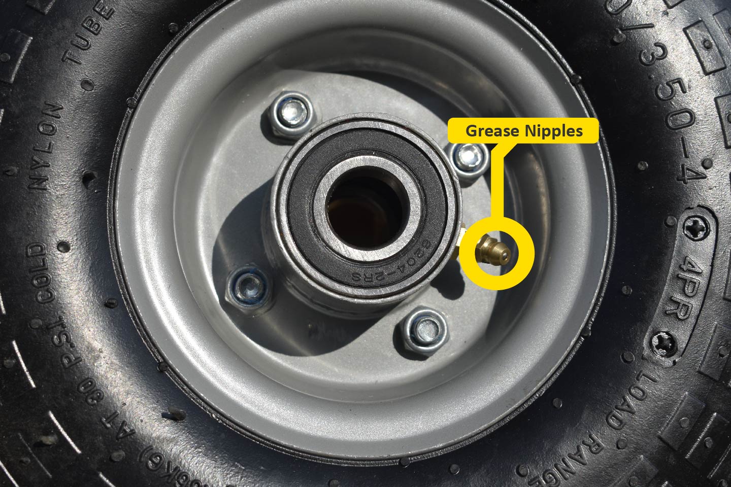 Close up of grease nipples for pneumatic wheels