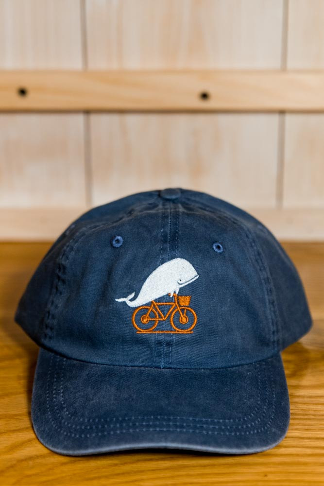TWGS Embroidered Whale-on-the-bike Logo Baseball Hat - Distressed Navy w/ Orange