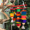 This colorful toy looks like a chandelier, and is perfect for medium and big birds. The thick wooden blocks with smaller pieces stacked together form the four pillars that swing around the center pole.  The sound of bells ringing will stimulate your birds even more! This colorful toy looks like a chandelier, and is perfect for medium and big birds. The thick wooden blocks with smaller pieces stacked together form the four pillars that swing around the center pole.  The sound of bells ringing will stimulate your birds even more!