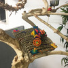 An adorable sea grass net decorated with small colorful bits, filled with shredded paper. This bird toy is great for foraging! An adorable sea grass net decorated with small colorful bits, filled with shredded paper. This bird toy is great for foraging!