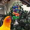 Three wheels hang down, decorated with cute little shapes, and completed with a bell tied at the bottom. It's so colorful, and the sound from the bell will get your bird very excited!