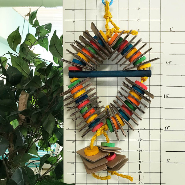 Interlocked with rectangular cardboard papers and round wooden pieces, small to medium size parrots can perch and busy with their beak side to side and high and low with this shreddable bird toy! Interlocked with rectangular cardboard papers and round wooden pieces, small to medium size parrots can perch and busy with their beak side to side and high and low with this shreddable bird toy!
