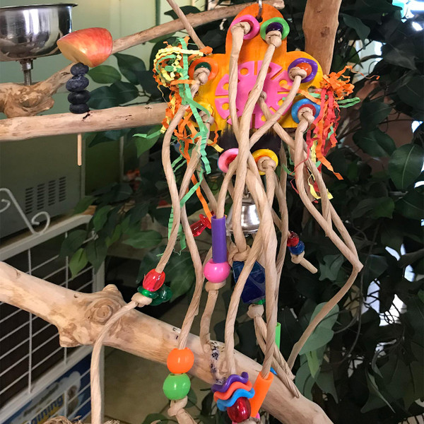 Trailed with strings of rolled papers, shredded papers, plastic beads and pieces, this shreddable bird toys floats like a squid.  The center wooden pieces is a big and thick piece,great for hours of shredding!  Trailed with strings of rolled papers, shredded papers, plastic beads and pieces, this shreddable bird toys floats like a squid.  The center wooden pieces is a big and thick piece,great for hours of shredding!